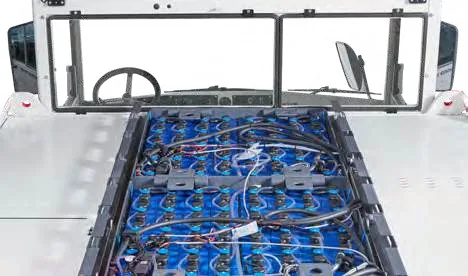 CHALLENGER 150e — open battery compartment with blue cells and wiring