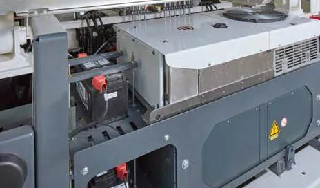 CHAMP 140e — closed equipment cabinet on the machine's frame