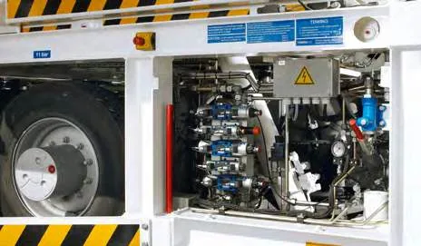CHAMP 70 — hydraulic valve block and pipework in the open compartment beside the wheel