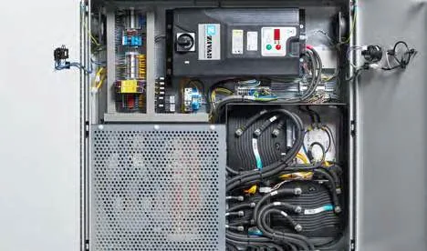 CHAMP 70We NEO — opened cabinet with control electronics and coiled cabling