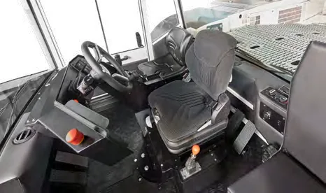 CHARGER 380 — enclosed cab interior with steering wheel and operator seat